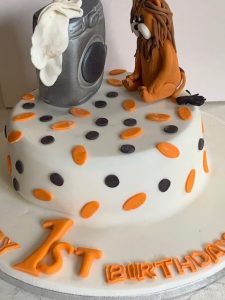 White, orange and black theme cake